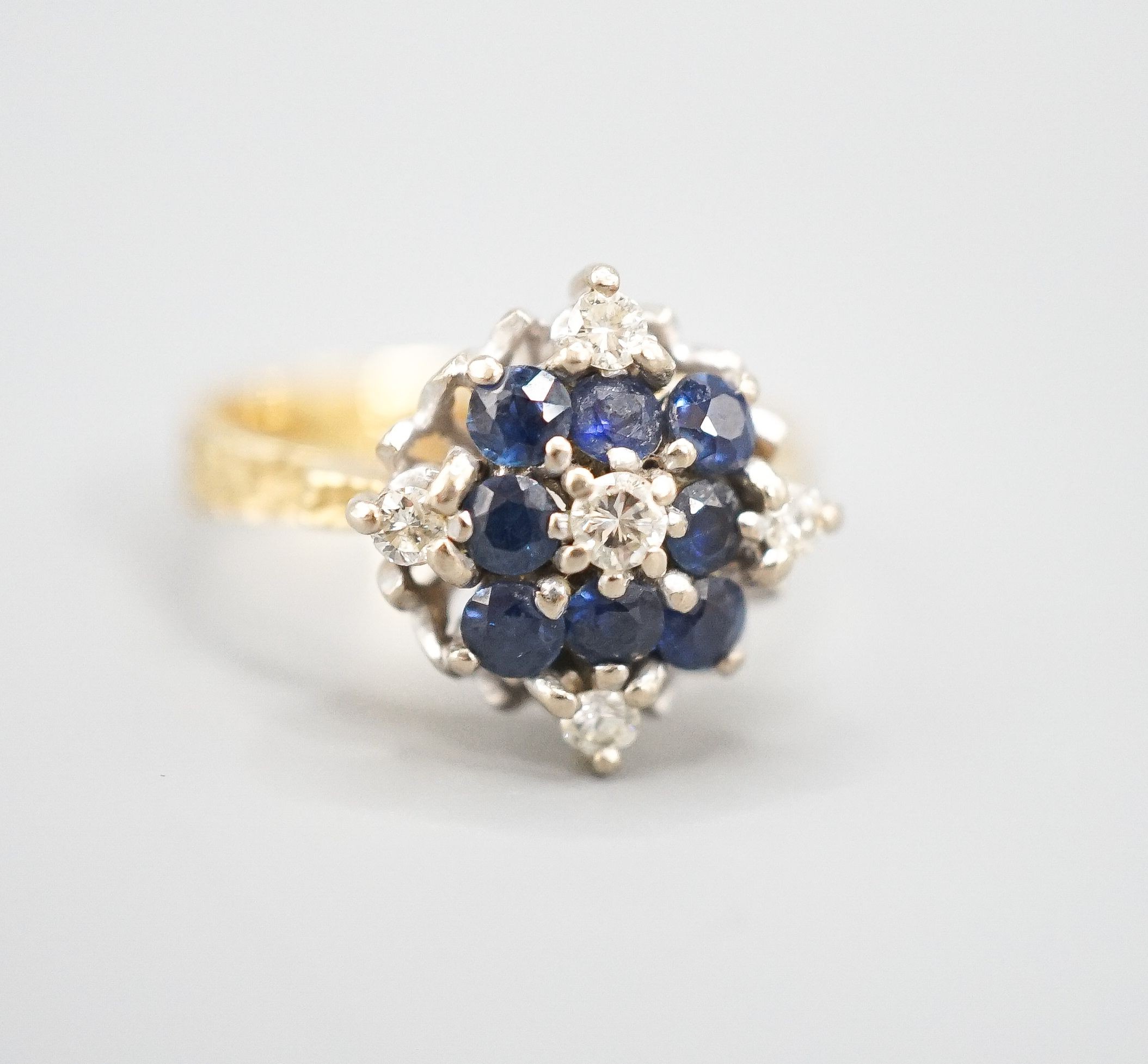 A 1960's 18ct gold, sapphire and diamond cluster ring, size Q, gross weight 5.8 grams.